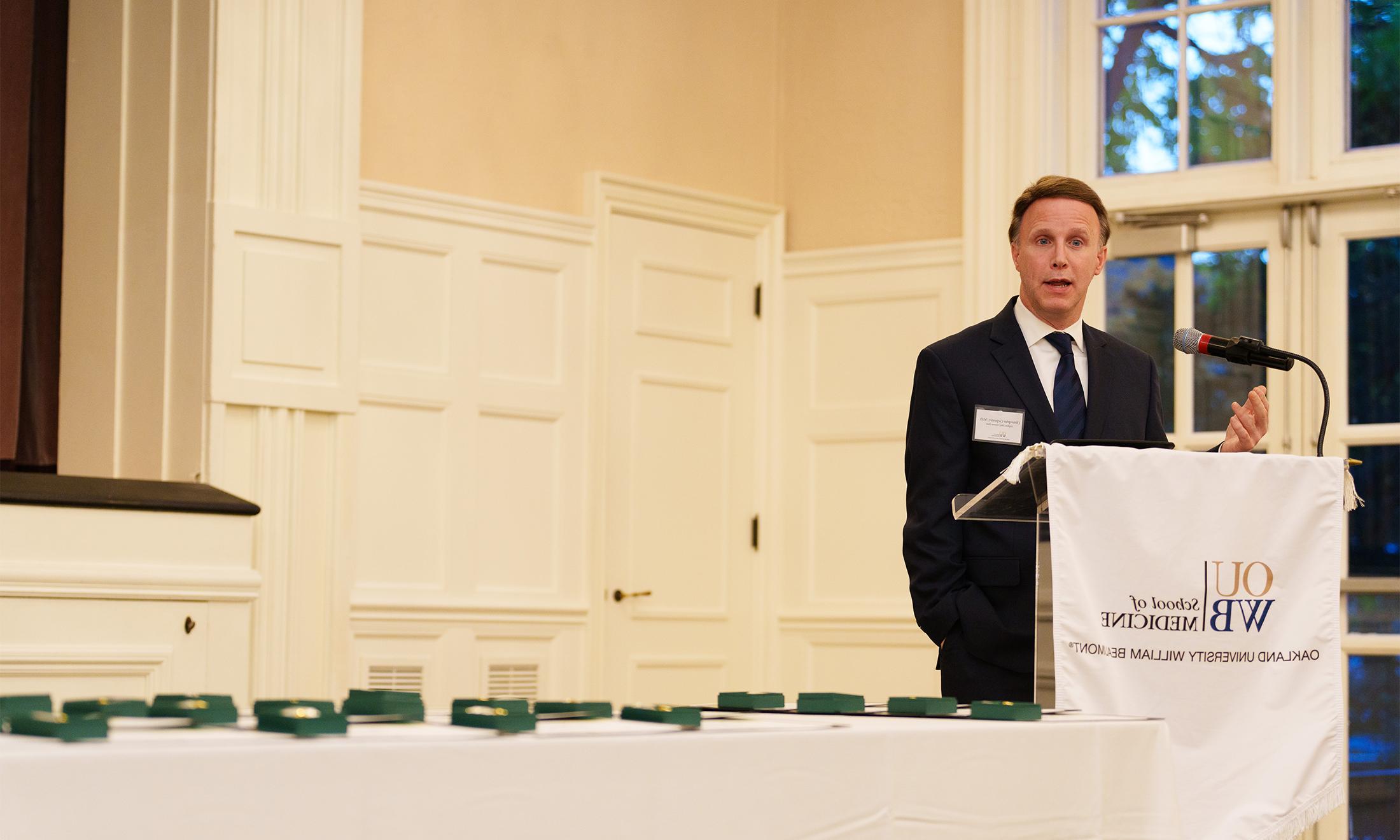 An image of Dr. Carpenter speaking at the AOA ceremony